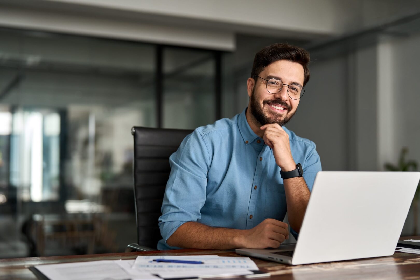 Business man in office smiling